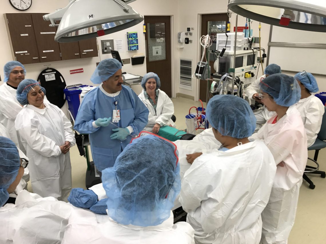 Belal Saadeh (center male nurse in blue) leads a Peri-Operative Course for practicing RNs.