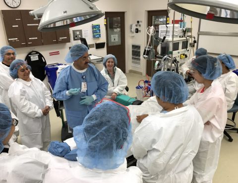 Belal Saadeh (center male nurse in blue) leads a Peri-Operative Course for practicing RNs.