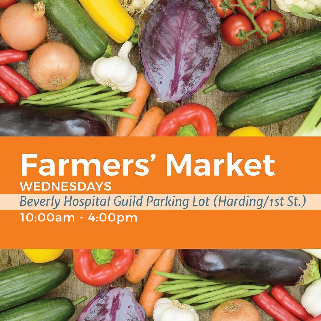 A graphic with an overhead shot of various vegetables. It says "Farmer' Market Wednesdays Beverly Hospital Guild Parking Lot (harding/1st St.) 10am - 4pm"