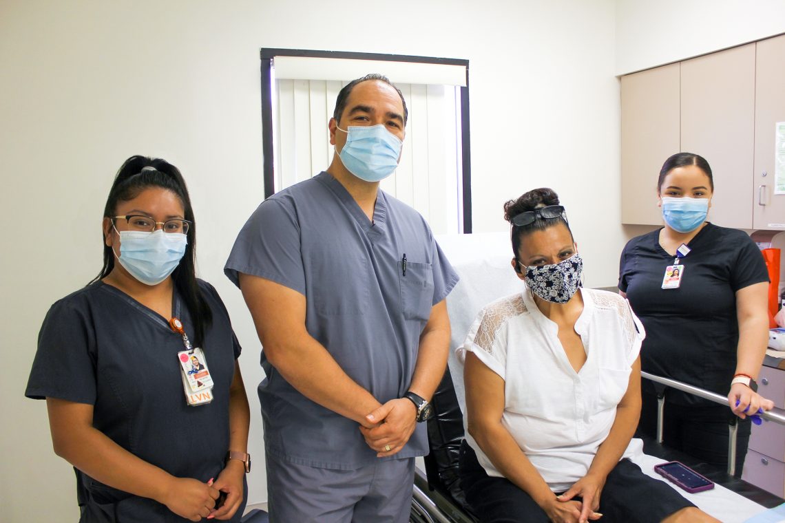 Wound Care Center Dr. Ananian and 2 staff members and patient smiling at camera