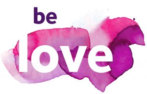 Graphic with the words "be love" and a dark pink splash background